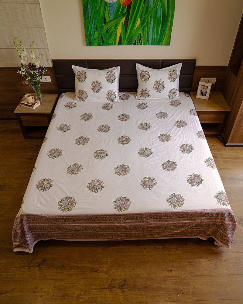 A Peaceful Elegant Bedroom with king size double bed draped with kalaaai's organic cotton hand block printed white bed sheet.