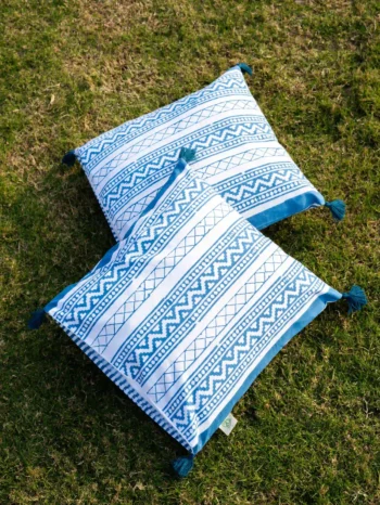 Victory Stripes organic cotton block print cushion cover with pom poms in blue colored striped design. Retirement gift by India's most trusted hand block print manfacturer.