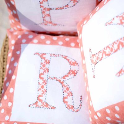 Hand block printed personalised Initial cushion cover in organic cotton fabric by India's best handicraft manufacturer, kalaaai studio. reversible cushion cover.