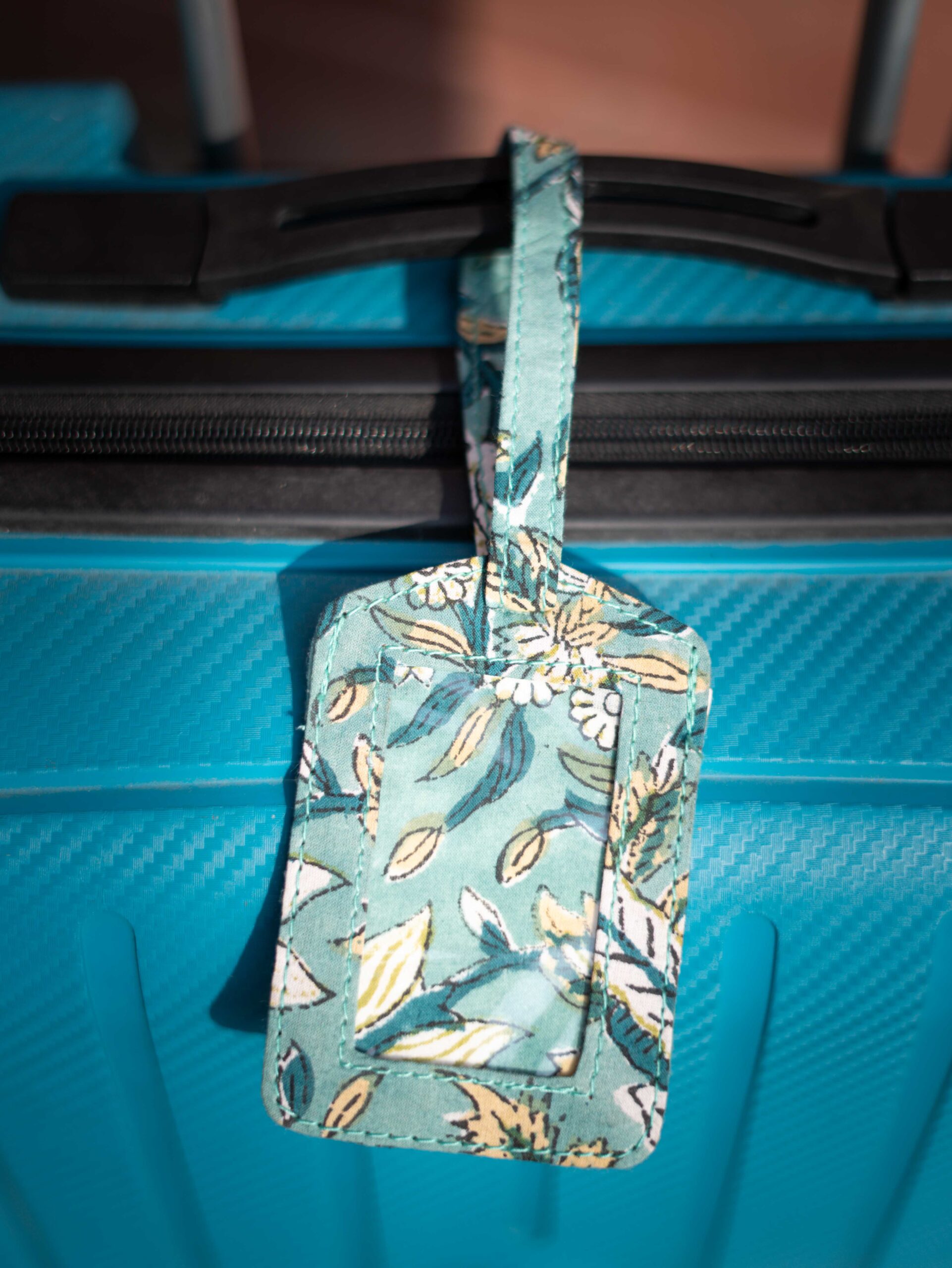 DSC01221 Heritage Traveler Upcycled Fabric Story Tags. Features traditional Indian prints such as Hand-Block prints. Artisan-made, cultural travel accessory.