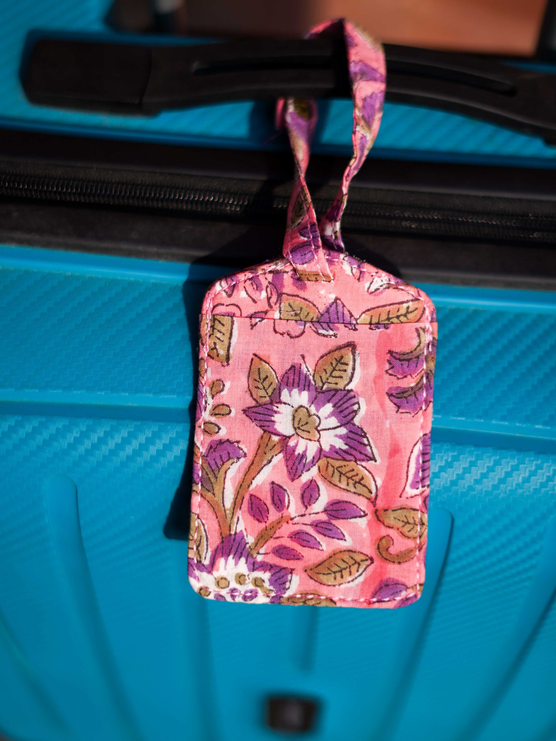 DSC01225 Cluster of Heritage Traveler Upcycled Fabric Story Tags. Features traditional Indian prints such as Hand-Block prints. Artisan-made, cultural travel accessory.