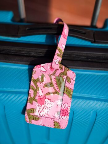 Cluster of Bohemian Wanderer Upcycled Fabric Story Tags. Features vibrant floral prints, rich paisleys, and intricate patterned patchwork in expressive colors. Handmade, 1-by-1 unique luggage tag collection made from zero-waste textile scraps.