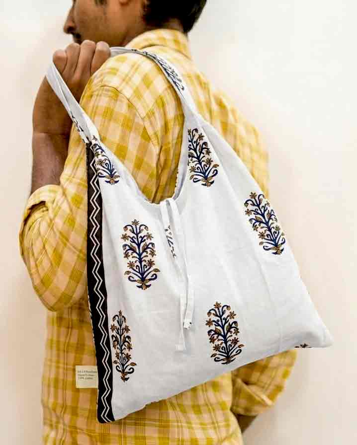 black-and-whte-kalai-tote Kalaaai Studio Tote Bag with hand block printed fabric in beautiful white and black color floral print. compactible bag to fit your pocket for an easy sustainable lifestyle. eco friendly corporate gift