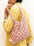 Kalaaai Studio Tote Bag with hand block printed fabric in beautiful orange and white color floral print. compactible bag to fit your pocket for an easy sustainable lifestyle. eco friendly corporate gift