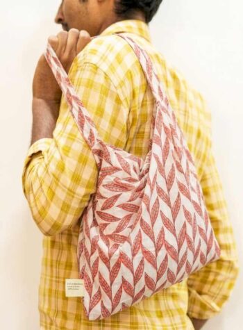 Kalaaai Studio Tote Bag with hand block printed fabric in beautiful orange and white color floral print. compactible bag to fit your pocket for an easy sustainable lifestyle. eco friendly corporate gift