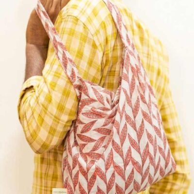 Kalaaai Studio Tote Bag with hand block printed fabric in beautiful orange and white color floral print. compactible bag to fit your pocket for an easy sustainable lifestyle. eco friendly corporate gift