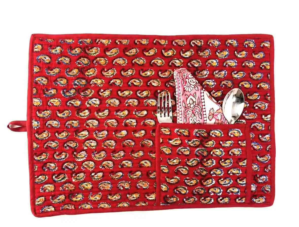 red-mat Paisley Roll-Up Travel Mat by Kalaaai Jaipur in deep red with yellow paisley bootis, handcrafted from quilted cotton and shown with built-in cutlery pocket, spoon, fork, and cotton napkin. This heritage-inspired reusable dining set rolls up compactly for easy carrying during office commutes, travel, picnics, and eco-friendly living.