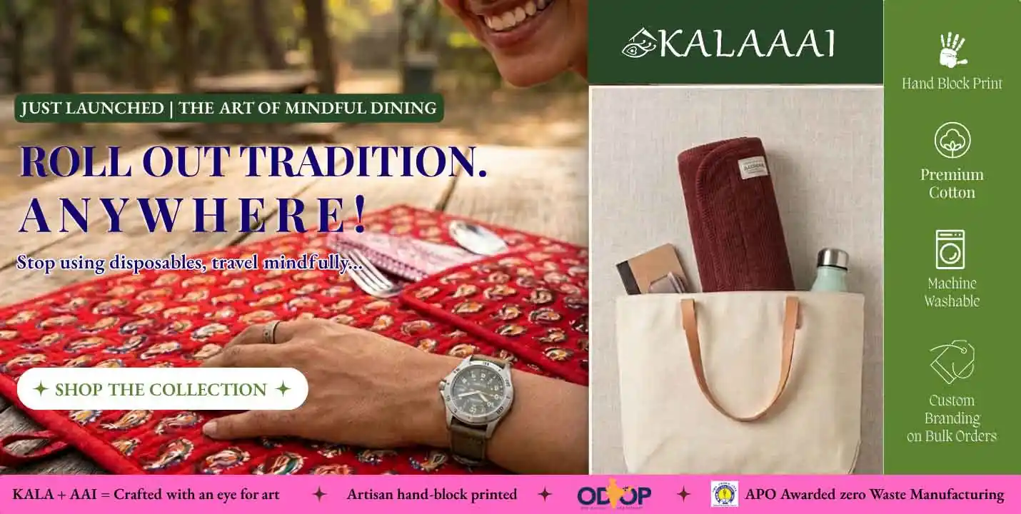 A product launch website banner showcasing a deep red, quilted hand-block printed paisley travel and dining mat on a rustic wooden picnic table outdoors. A person with a warm smile is partially visible, their hand wearing an adventurous field watch resting gently on the mat next to tucked-in cutlery. To the right, a split inset features a sleek canvas travel tote bag with a matching solid deep red variant mat neatly rolled up inside, illustrating portability and conscious, on-the-go dining.